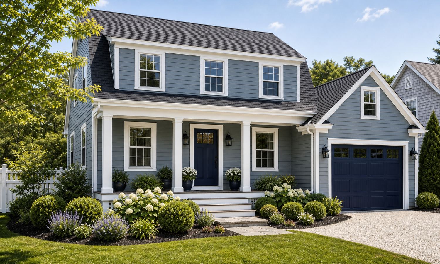 House exterior painted blue gray with navy door